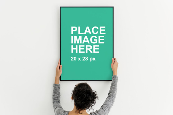 Woman holding black frame