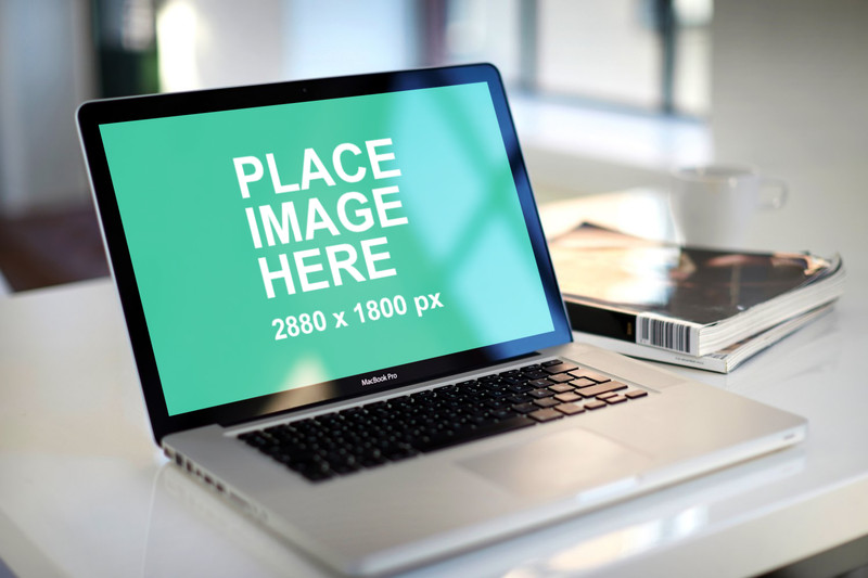 Free Macbook Pro template on white table