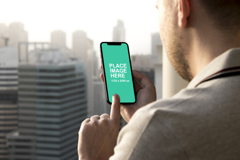 Man using black iPhone X mockup