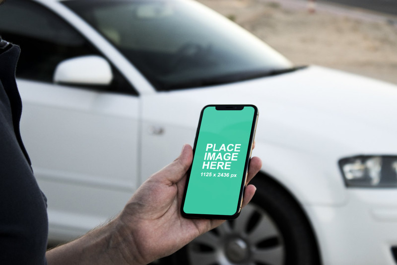 Man holding iPhone X mockup