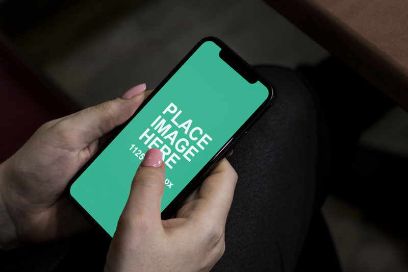 Woman using black iPhone X mockup