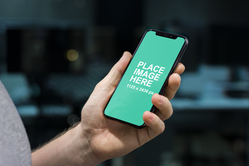 Man holding iPhone X