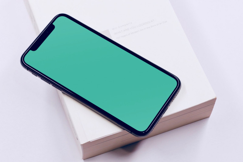 iPhone X on book