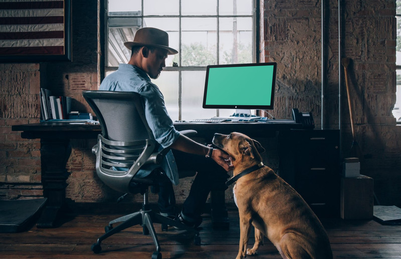 Man at desk with iMac