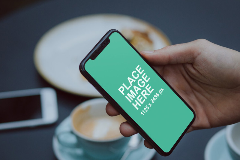 Man holding iPhone X