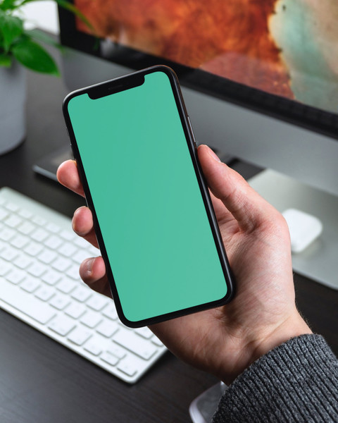 Man holding iPhone X