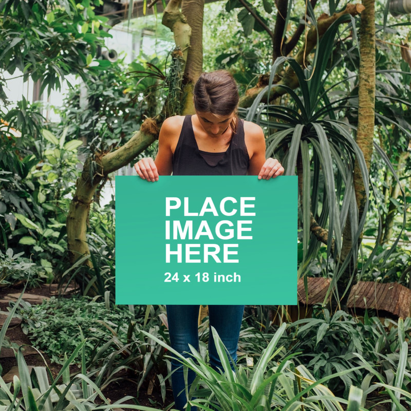 Woman holding blank canvas