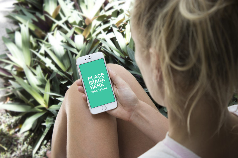 Woman holding iPhone 6